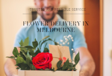 Person holding a flower box from Melbourne Florist featuring a vibrant red rose, symbolizing trusted and reliable flower delivery service in Melbourne.